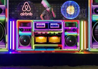 DJ Booths, Holograms & Lighting (5) A DJ host using a DJ booth with holograms inside.