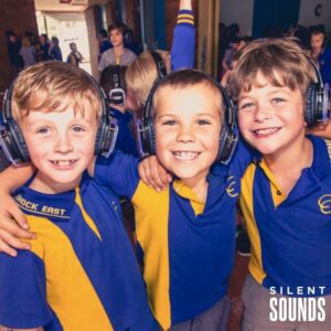 SILENT DISCO FOR SCHOOLS AND OSHC HIRE (3) Smiling school kids wearing Silent Sounds Headphones at a school