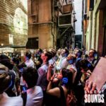 SILENT WALKING TOUR HIRE (3) A group of people viewing artwork in a laneway wearing Silent Sounds Headphones.